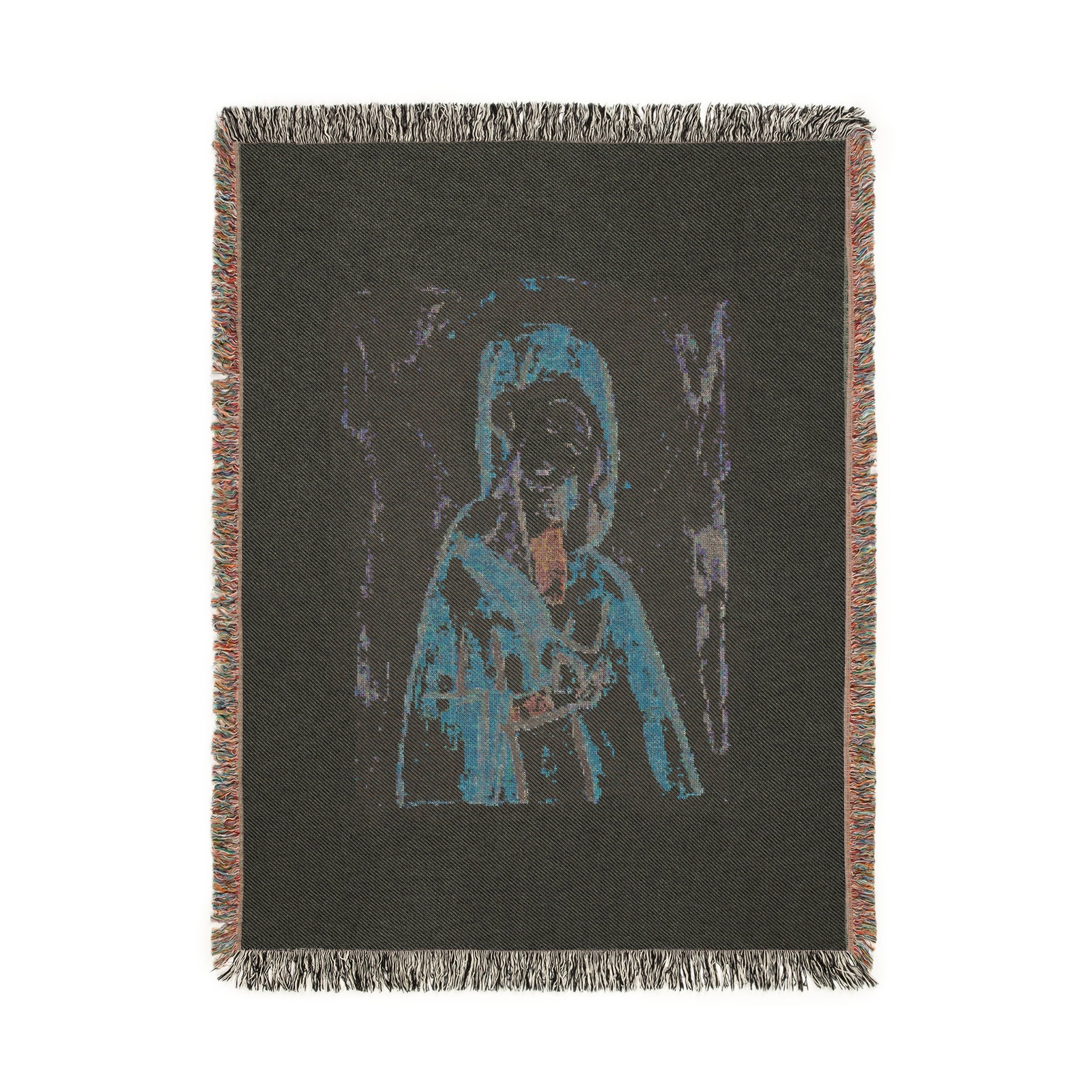 Woven blanket with a graphic design of a dog and landscape on a black background